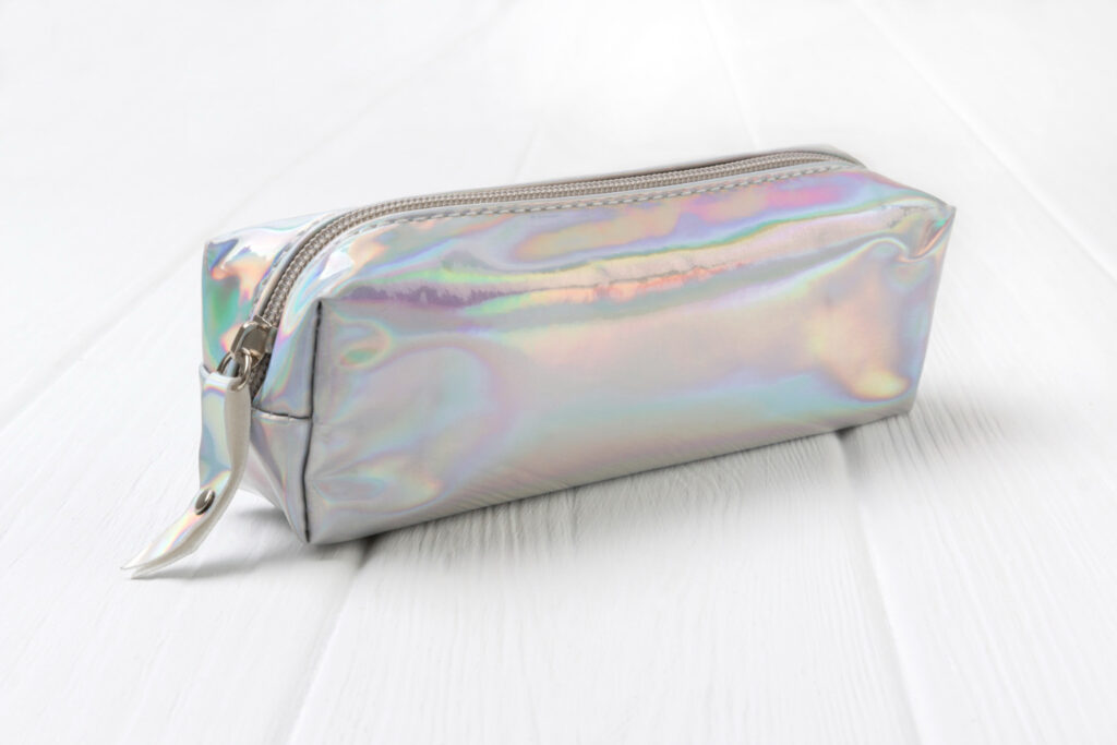 holographic-pencil-case-white-wooden-table