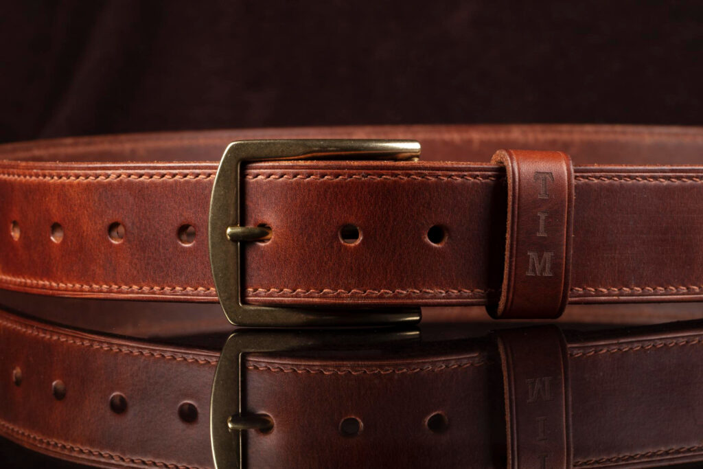 leather-brown-belt-dark-background-with-reflection