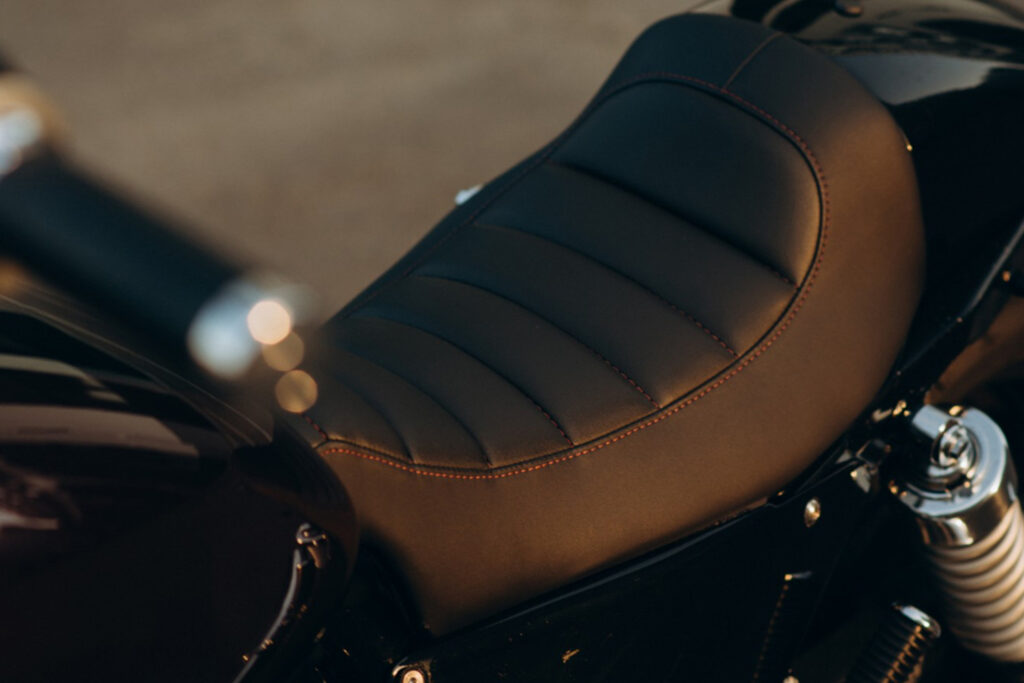 leather-motorcycle-seat-close-up-stylish-custom-chopper-motobike-with-chrome-details-soft-selective-focus (2) edit